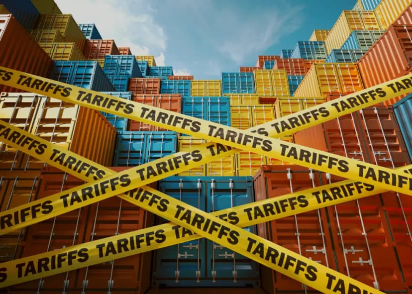 colorful shipping containers stacked behind caution tape which says tariffs