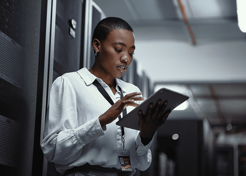 Woman using an ipad in a server room