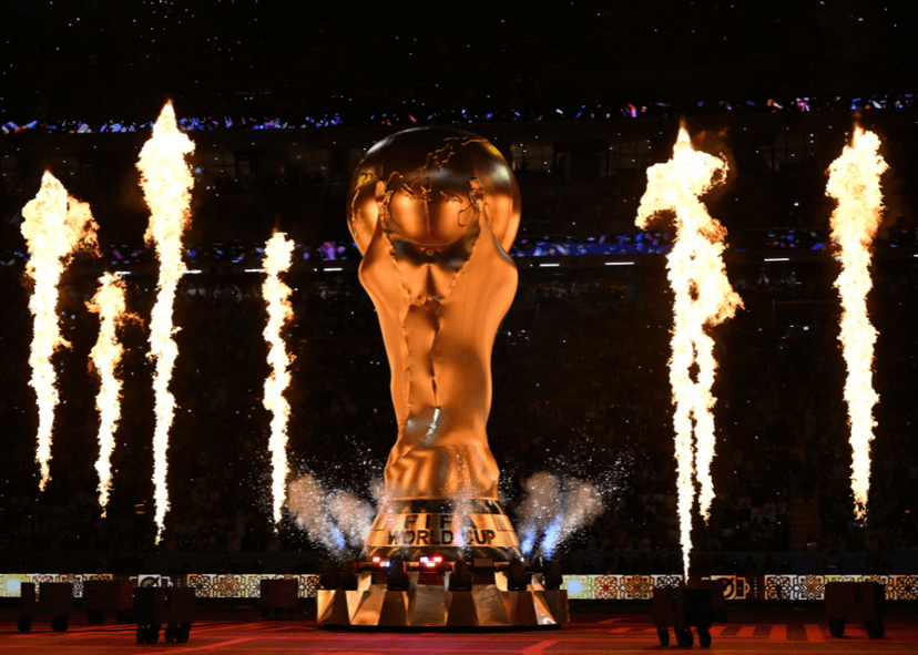Large Fifa trophy with pyrotechnics around it