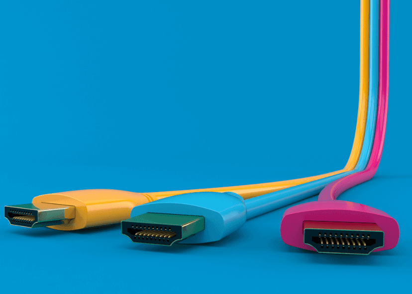 Colored HDMI cables on blue background